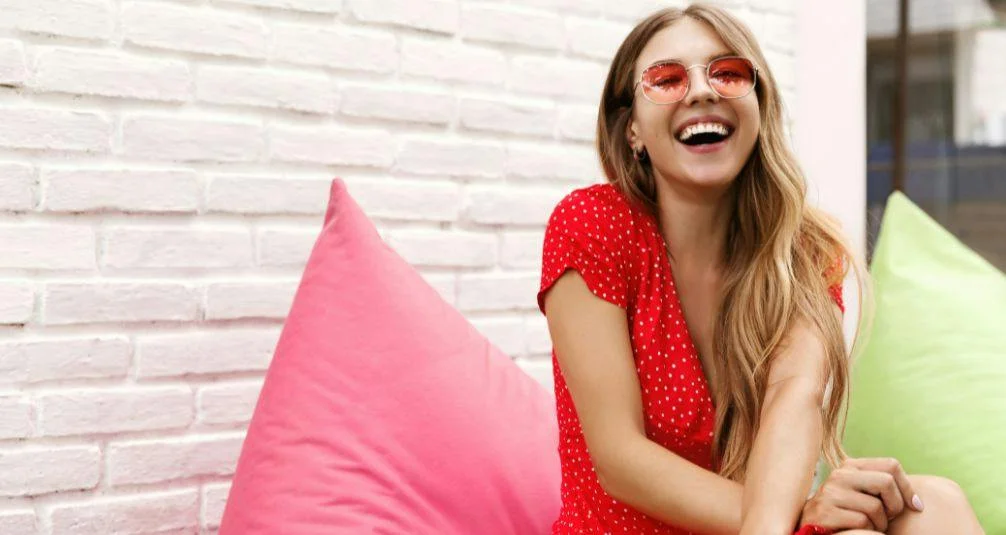Woman with facepaint sitting on beanbag