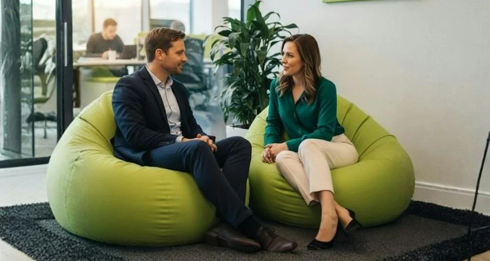 Two people having a personal conversation in a workplace setting