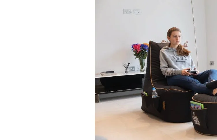Gaming on Beanbag with footstool